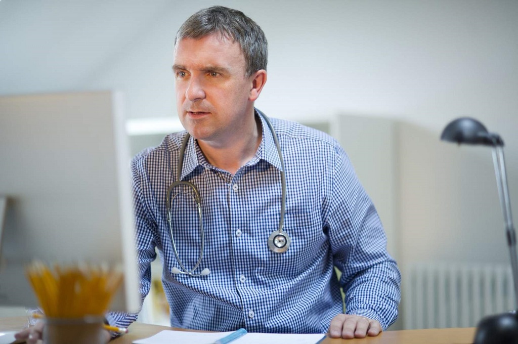 Doctor at computer desk